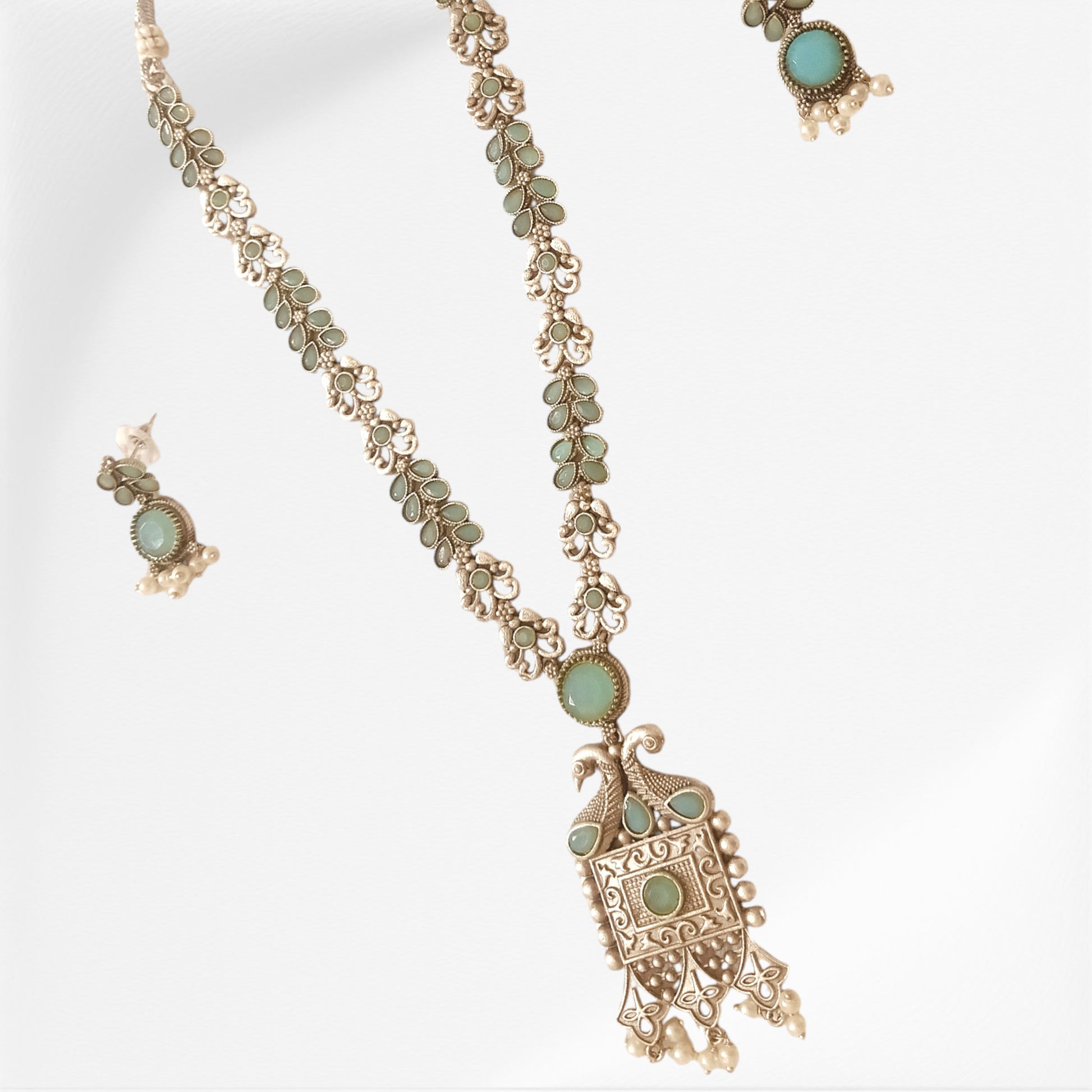 Silver-Costume-Jewelry-Set-With-Earrings-In-Ice-Blue-Color-Stone